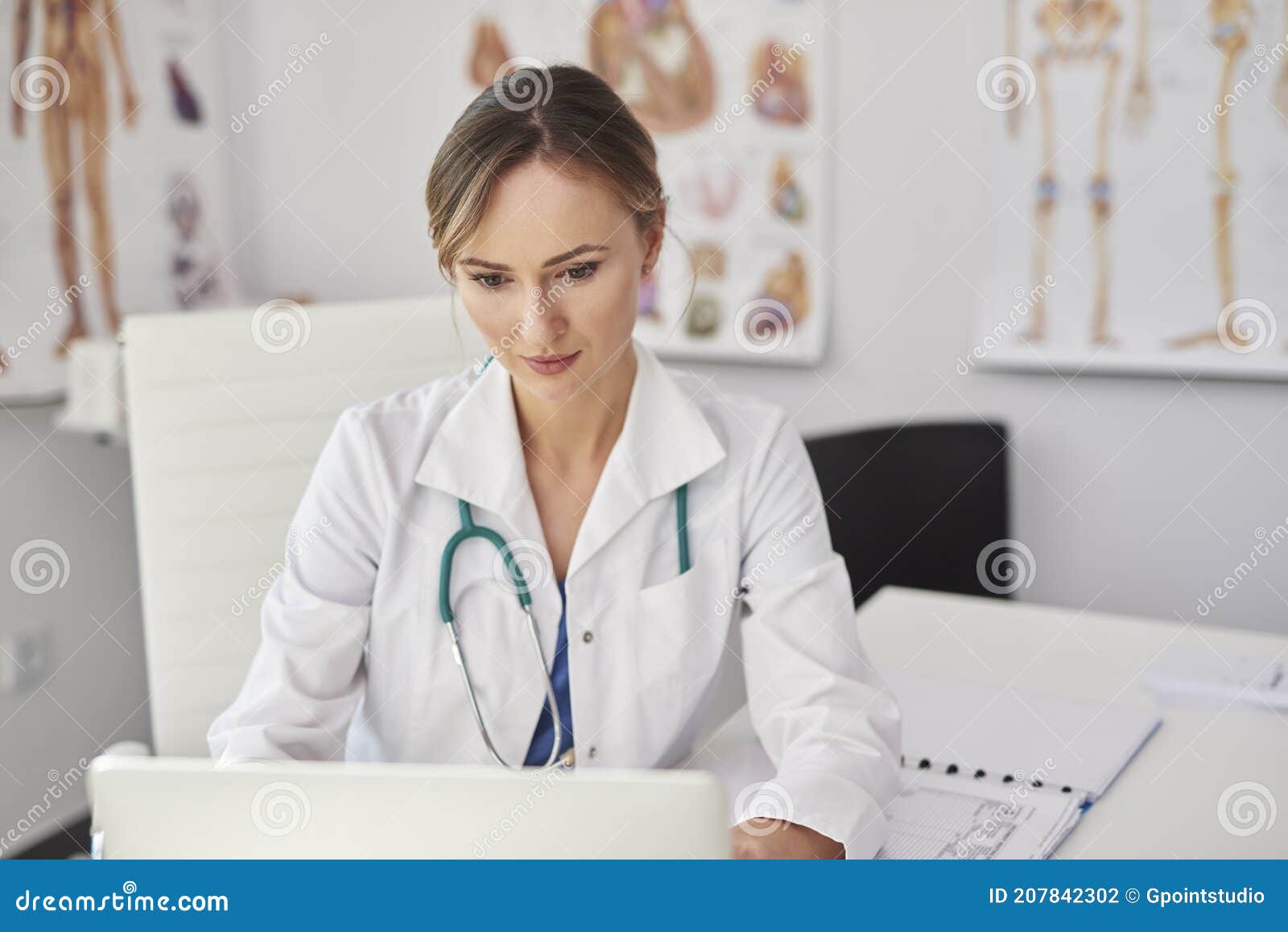 female doctor working with technology in doctorÃ¢â¬â¢s office